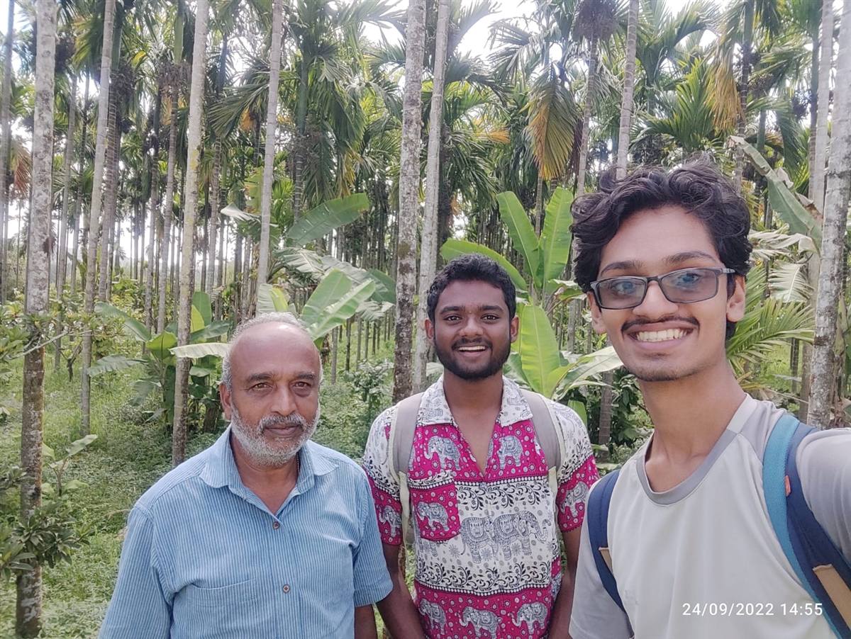 Prakheti team walking a spice and areca forest garden with a farmer elder in Kerala